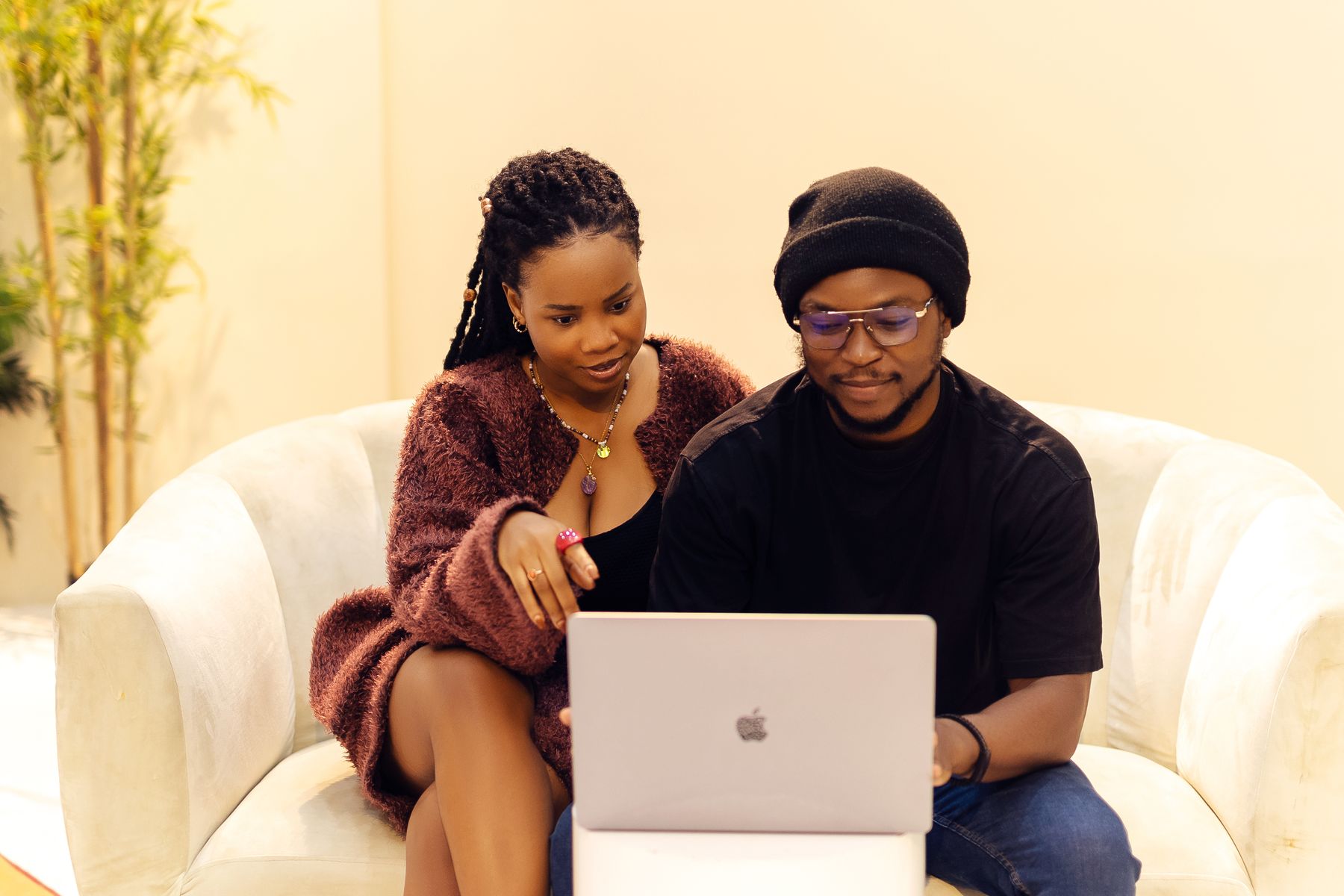 Nigerian professionals reviewing work together on a laptop in Lagos